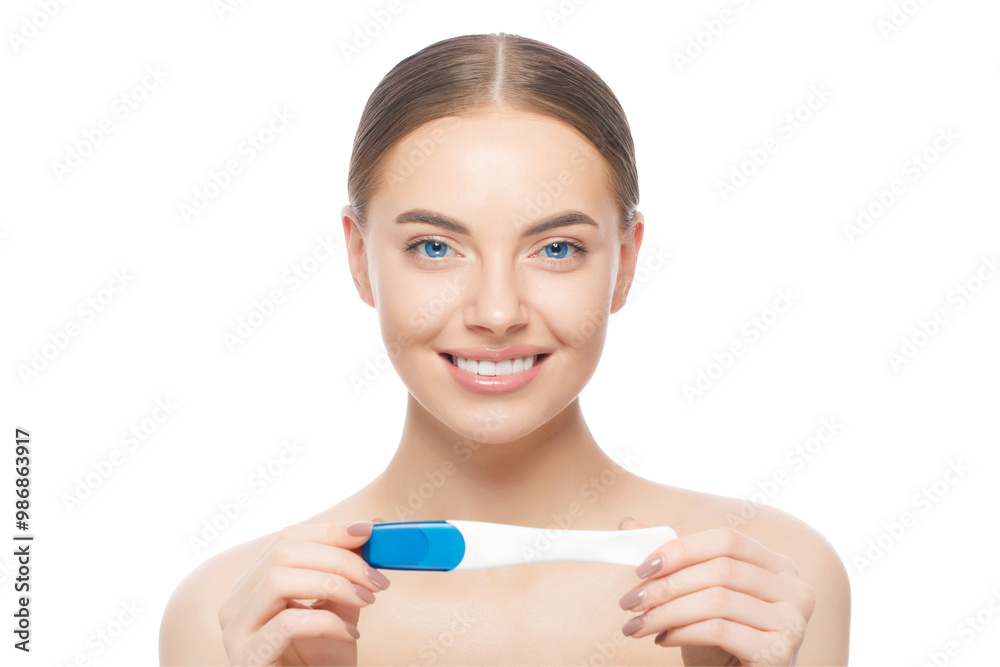 Young beautiful woman holding pregnancy test, feeling happy about result, standing shirtless Young beautiful woman holding pregnancy test, feeling happy about result, standing shirtless