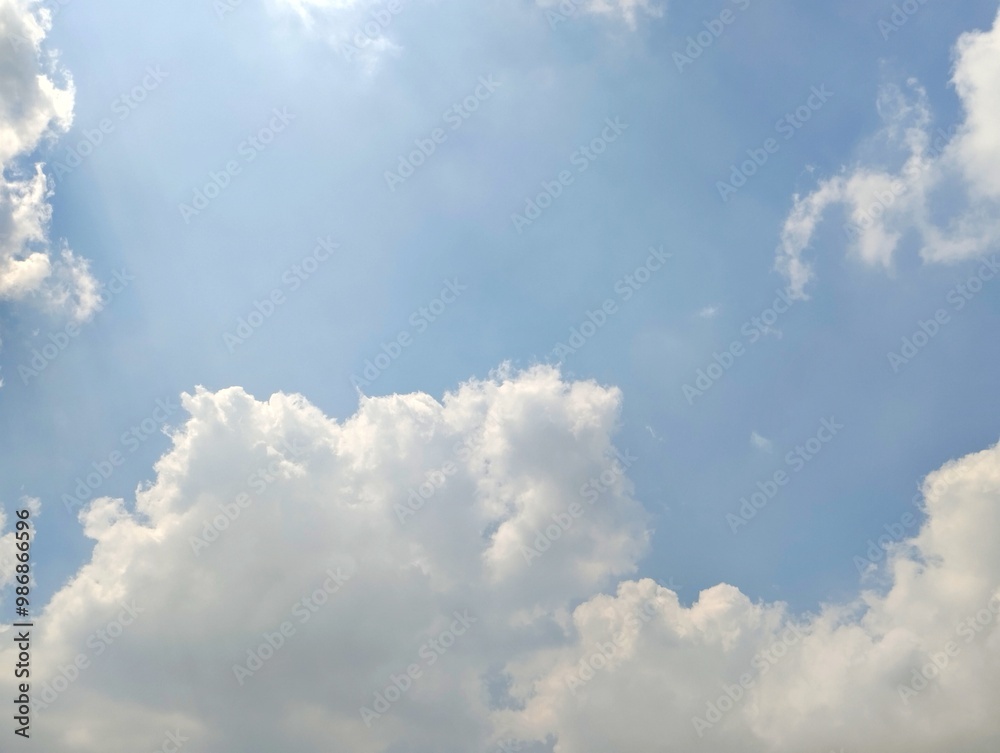 Natural background of bright blue sky with clouds during the day Natural background of bright blue sky with clouds during the day