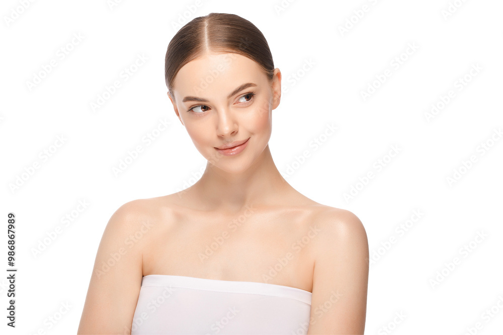 Portrait of young beautiful woman with tied hair after morning beauty routine looking right