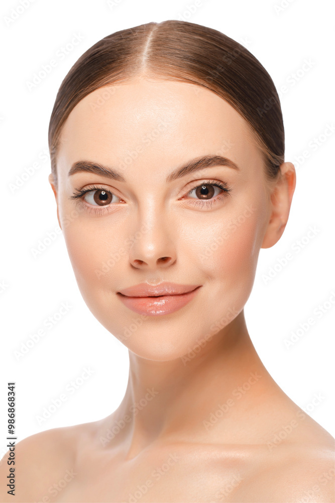 Beauty woman face with brown eyes looking at camera. Beautiful model girl with perfect clean fresh skin. Skin care treatment or cosmetic ads