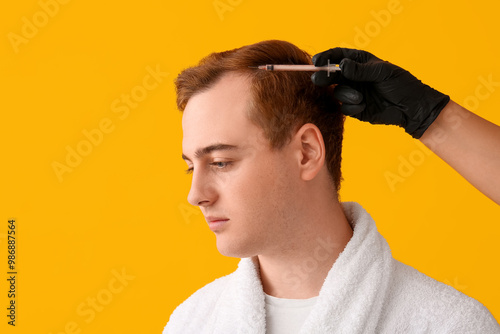 Young redhead man with hair...