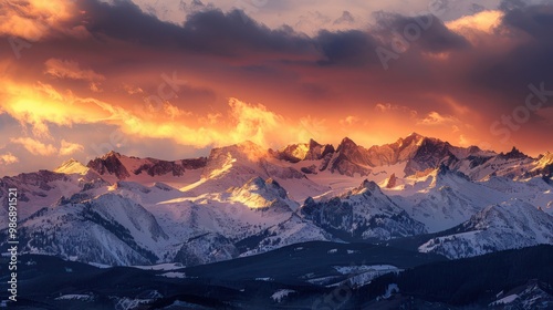 A stunning sunrise over alpine mountains, with the first light of day casting a golden glow on the snowy peaks.