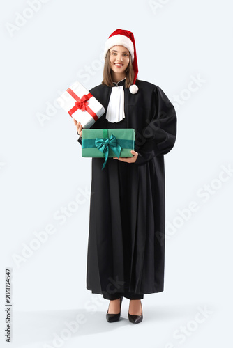 Female judge in Santa hat w...