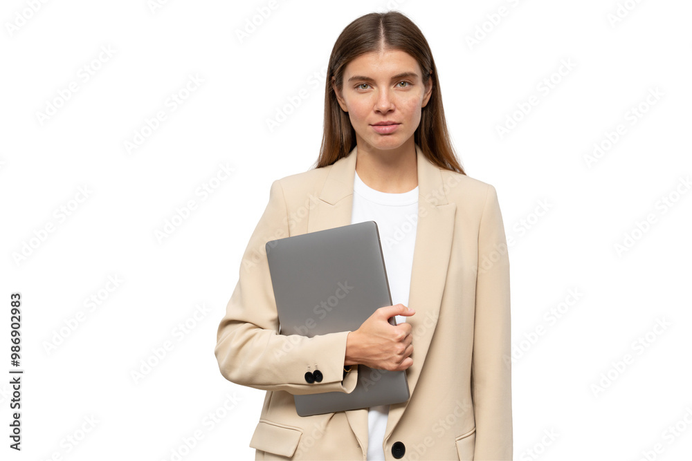 Serious businesswoman holding closed laptop in hands Serious businesswoman holding closed laptop in hands