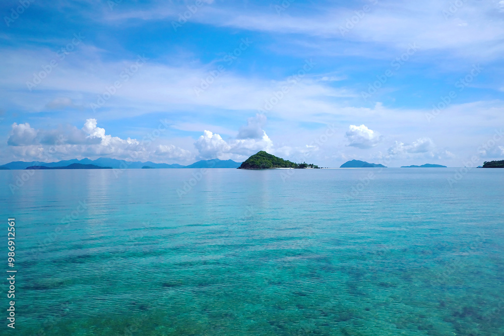 A view of the distant islands in front of us in the beautiful sea. A view of the distant islands in front of us in the beautiful sea.