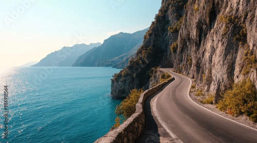 Scenic coastal road along rugged cliffs with ocean in the background