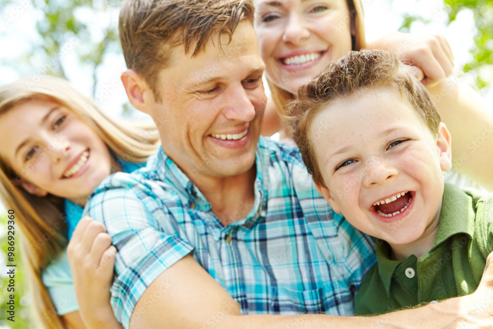 Fototapeta premium Portrait, family and bonding with hug, love and parents with children, outdoor and embrace in nature. Happy, woman and man with kids, together and relax in weekend, fun and break in park and youth