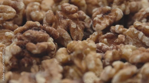 Close up of peeled walnuts with smooth rotation motion
