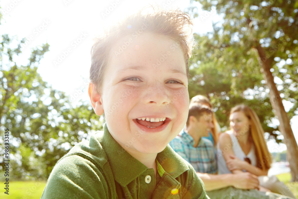 Portrait, happy child and family in garden on weekend, holiday or vacation in backyard or summer. People, bonding and outdoor with parents, joy and smile as playful for fun, love and support in Spain