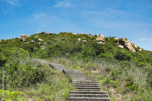 The trails in Lamma Island Hong Kong from Sok Kwu Wan and Ling Kook Shan, walking through stair steps to the summit photo