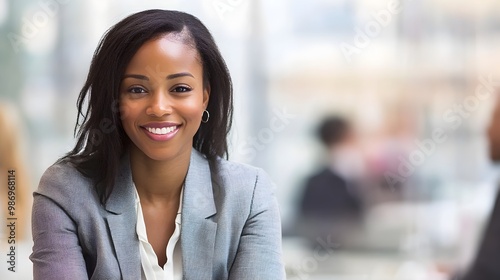 Confident Young Business Woman Smiling in Modern Office Environment