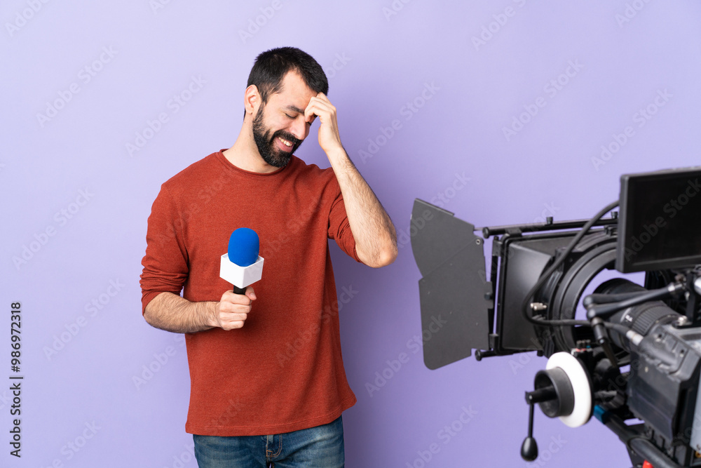 Reporter man holding a microphone and reporting news over isolated purple background laughing Reporter man holding a microphone and reporting news over isolated purple background laughing