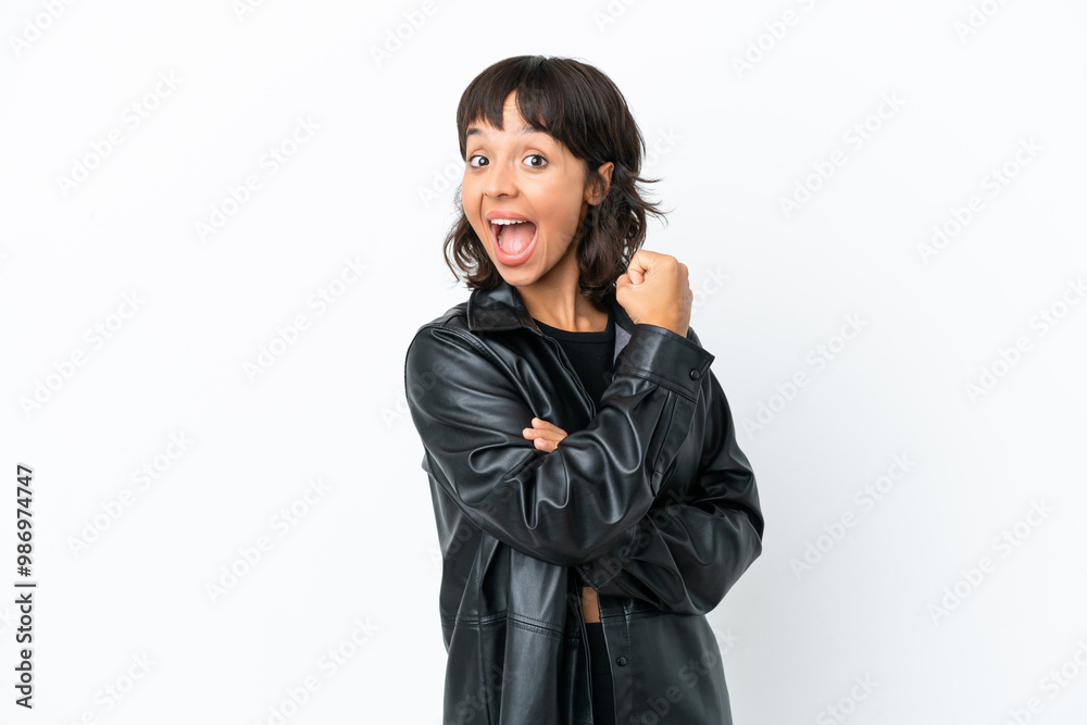 Young mixed race woman isolated on white background celebrating a victory Young mixed race woman isolated on white background celebrating a victory