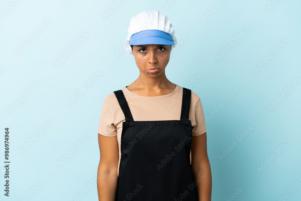 Fishwife asian woman over isolated background with sad expression Fishwife asian woman over isolated background with sad expression