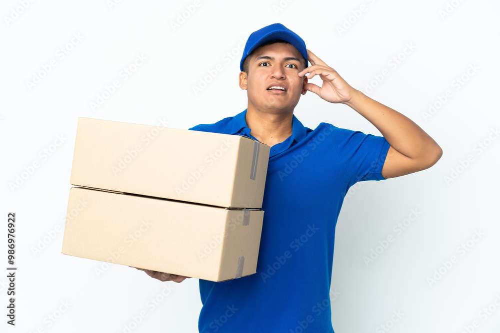 Delivery Ecuadorian man isolated on white background with surprise expression