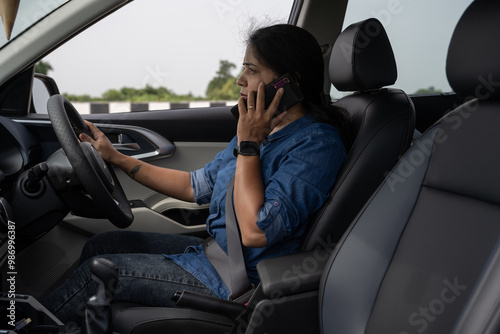 Wallpaper Mural Pretty Indian woman using mobile phone in the car  Torontodigital.ca