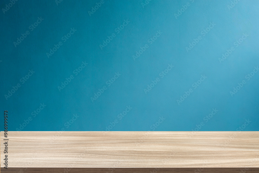 Empty wooden table top and color blue wall background for showing products and advertisers. Template mock up for display of product. product promotion in the wall. for display or montage. Empty wooden table top and color blue wall background for showing products and advertisers. Template mock up for display of product. product promotion in the wall. for display or montage.