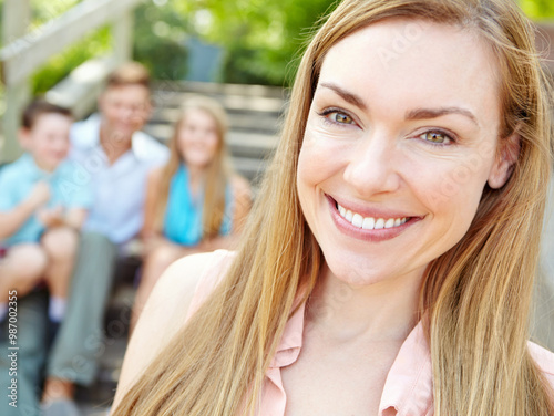 Portrait, happy and woman with family outdoor for summer vacation, relaxing and bonding together with love. Smile, mother and holiday peace of travel with kids, man and calm morning for weekend break