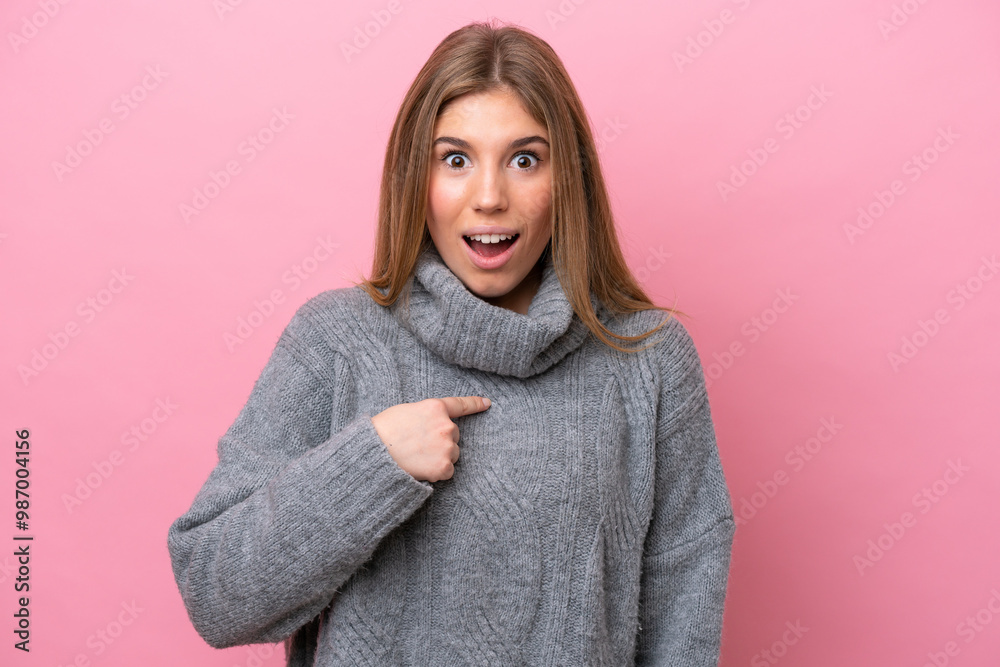 Young caucasian woman isolated on pink bakcground with surprise facial expression