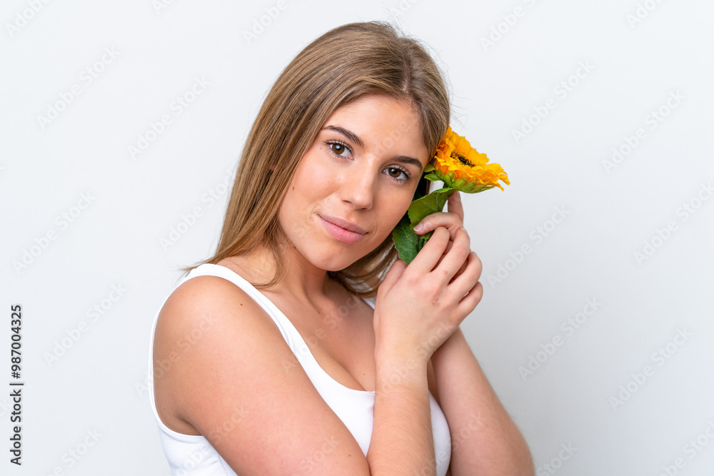 Young caucasian woman isolated on white background holding a sunflower. Close up portrait Young caucasian woman isolated on white background holding a sunflower. Close up portrait