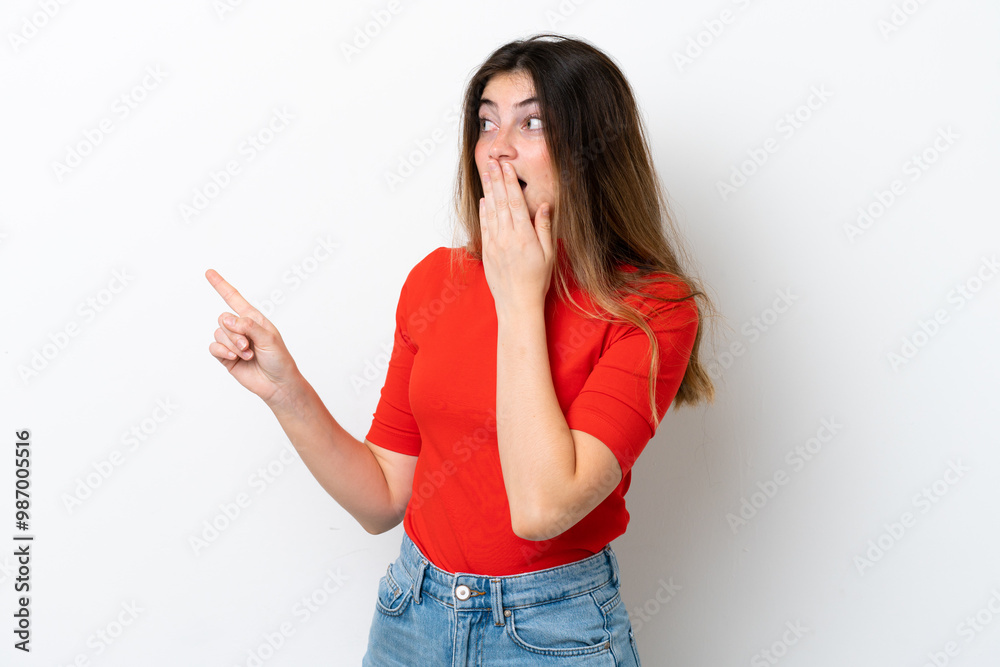Young caucasian woman isolated on white background with surprise expression while pointing side Young caucasian woman isolated on white background with surprise expression while pointing side