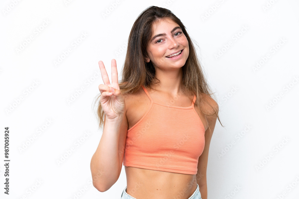 Young caucasian woman isolated on white background smiling and showing victory sign Young caucasian woman isolated on white background smiling and showing victory sign