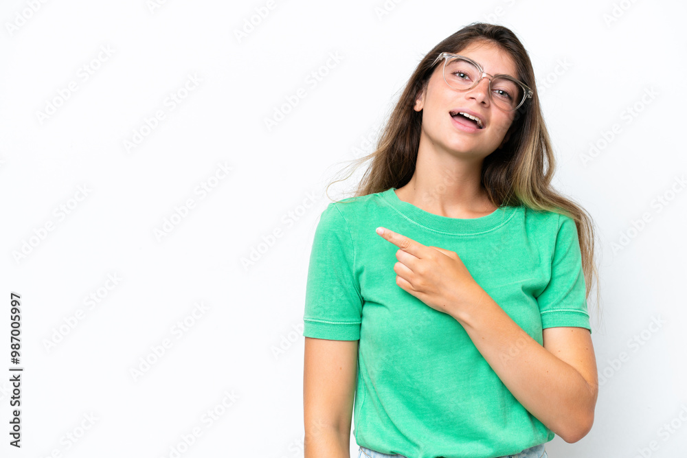 Young caucasian woman isolated on white background pointing to the side to present a product Young caucasian woman isolated on white background pointing to the side to present a product
