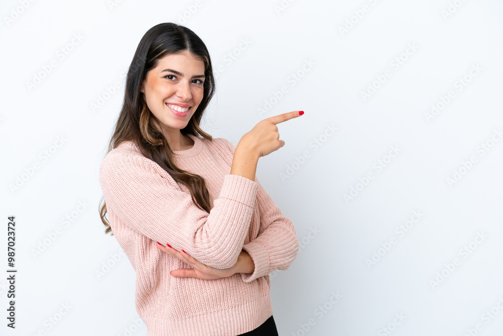 Young Italian woman isolated on white background pointing finger to the side Young Italian woman isolated on white background pointing finger to the side