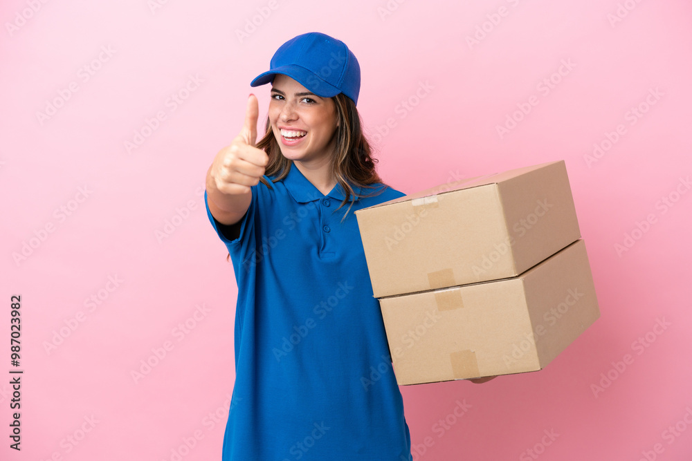 Delivery Italian woman isolated on pink background with thumbs up because something good has happened Delivery Italian woman isolated on pink background with thumbs up because something good has happened
