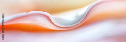  A crisp image of a white and orange wave against an orthogonal background, featuring a distinctly defined, light orange crest