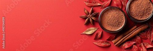  A red background with cinnamon and star anise at its base; below, a golden star anisette photo