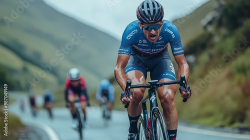 Competitive cyclists race on a hilly road, showcasing intense effort and determination in a scenic outdoor setting.