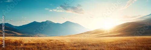  The sun shines brightly over distant mountains; a horse grazes in the nearby field