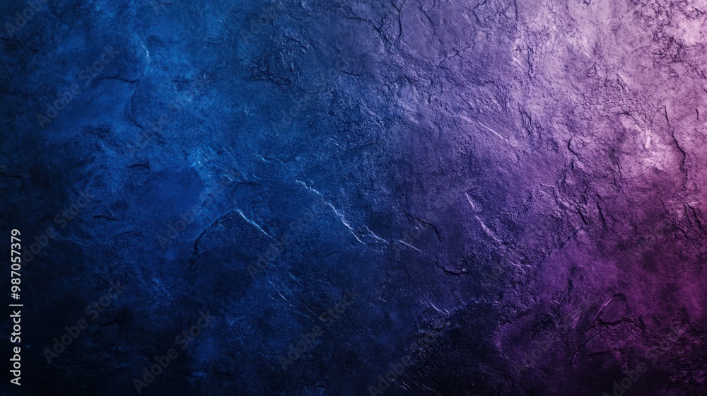Naklejka premium Abstract gradient background with a rough texture blending shades of deep blue and purple, creating a rich, moody atmosphere.