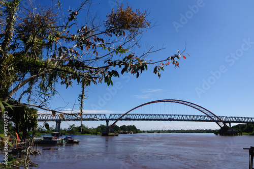 A view of Kahayan Bridge. It is 640 meters long and 9 meters wide modern bridge over Kahayan river in Central Kalimantan, Indonesia.  photo