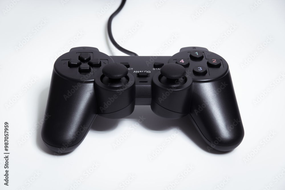 Black controller on white background, Video game device, Joystick on a white background. Black controller on white background, Video game device, Joystick on a white background.