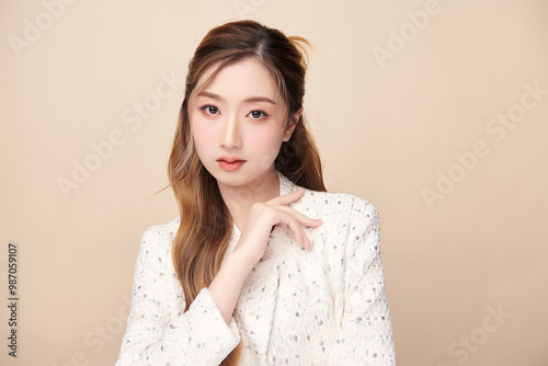 Beautiful young asian woman with clean fresh skin on beige background, Face care, Facial treatment, Cosmetology, beauty and spa, Asian women portrait.