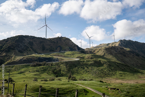 Obraz na płótnie Windfarm on top of the hill under a fluffy cloud sky. Hawke's Bay. New Zealand. w salonie