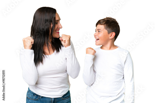 Little caucasian kid over isolated chroma key background celebrating a victory