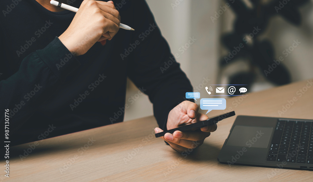 Businessman using a smartphone and touching on virtual screen contact icons, Contact us or Customer support hotline people connect, symbol telephone, mail, address and mobile phone.