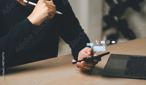 Businessman using a smartphone and touching on virtual screen contact icons, Contact us or Customer support hotline people connect, symbol telephone, mail, address and mobile phone.