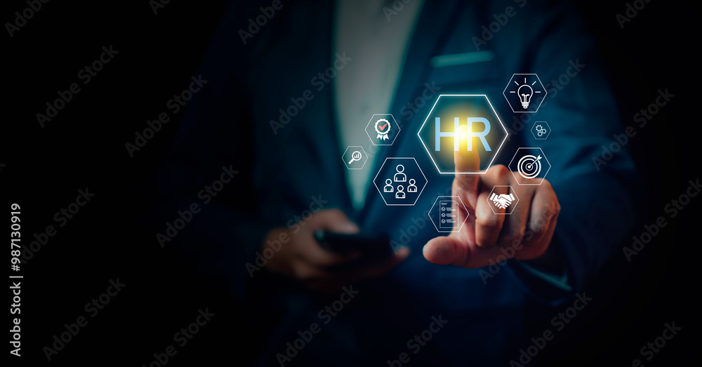 Businessman touching to virtual screen with infographic and HR wording, HR management, administration of human resources within an organization, focusing on recruitment, training, conflict resolution.