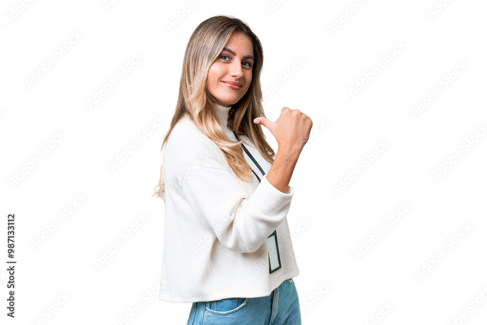 © luismolinero - Young Uruguayan woman with ID card over isolated background proud and self-satisfied