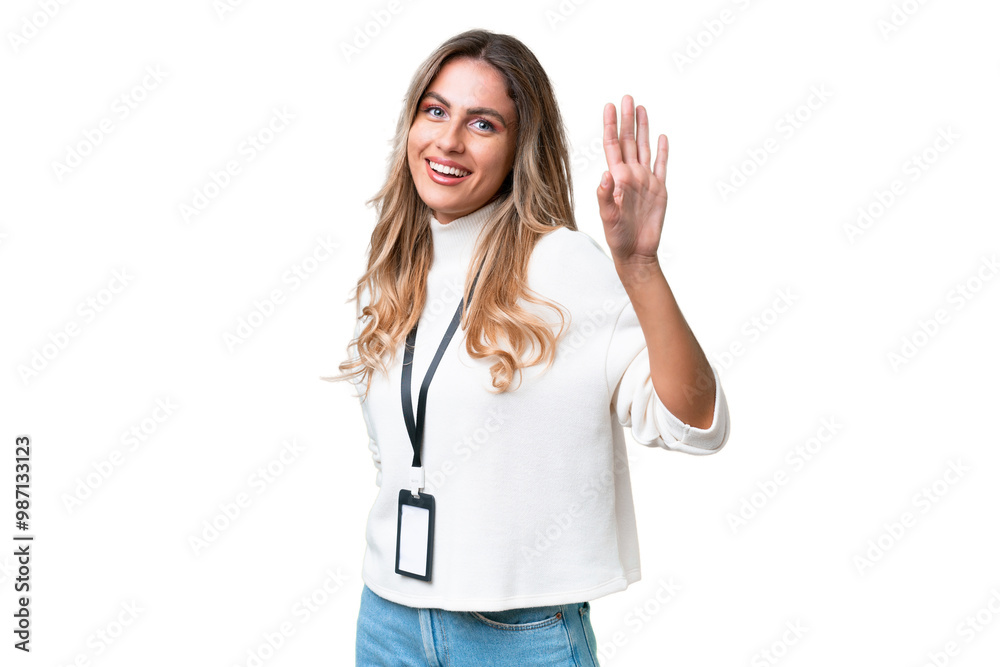 Young Uruguayan woman with ID card over isolated background saluting with hand with happy expression Young Uruguayan woman with ID card over isolated background saluting with hand with happy expression