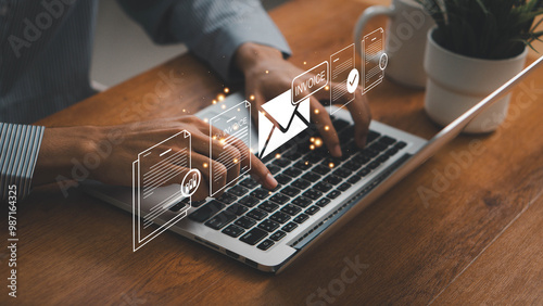 E-invoice and online digital statements concept. Businessman using computer laptop with invoice icons on virtual screen.