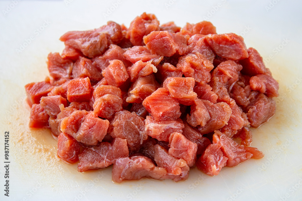 Diced red meat. Cooking in the kitchen. Diced red meat. Cooking in the kitchen.