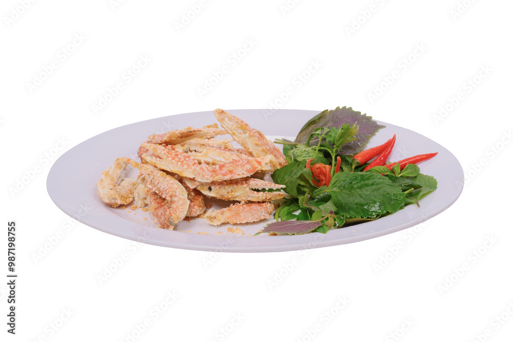 a plate of salted sentinel crab claws accompanied by fresh herbs and red chilies on a white background. The dish looks appetizing and well-presented, highlighting its gourmet appeal. a plate of salted sentinel crab claws accompanied by fresh herbs and red chilies on a white background. The dish looks appetizing and well-presented, highlighting its gourmet appeal.