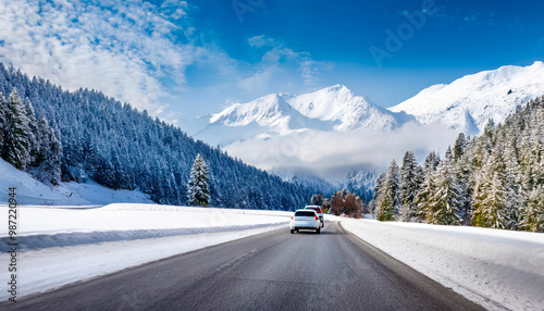 white car drive on mountain road landscape in winter. Nature scenery on highway in green 