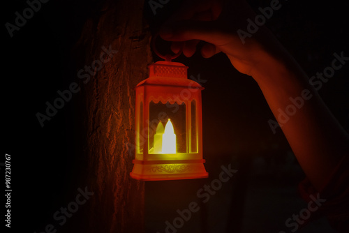 Diwali or deepavali photo with female holding oil lamp light or diya during festival of light with space for text isolated on black background.
 photo