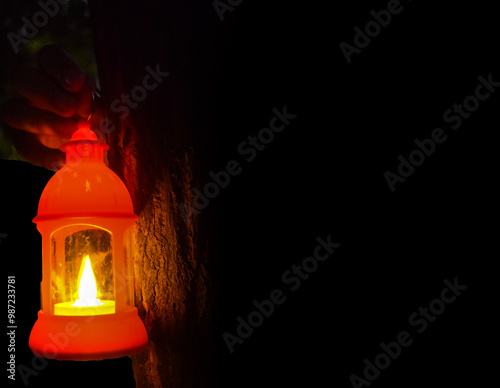 Diwali or deepavali photo with female holding oil lamp light or diya during festival of light with space for text isolated on black background.
 photo